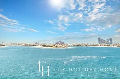 a view of a beach with the words hush holiday home at LUX The Dream Palm Atlantis Sea View Suite in Dubai