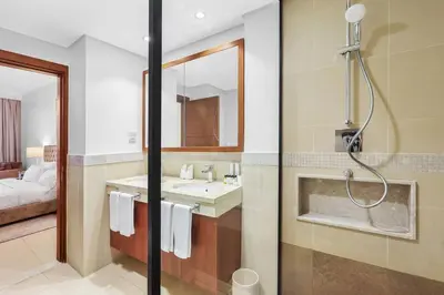 a bathroom with a shower and a sink at FIRST CLASS 2BR Stunning City Views in Dubai