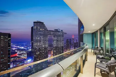 a view of a city skyline from the balcony of a building at FIRST CLASS 2BR Stunning City Views in Dubai