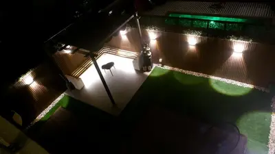 an overhead view of a backyard at night at Bliss at the Fields, 5BR Villa with Garden in Meydan in Dubai
