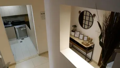a small bathroom with a sink and a shower at Bliss at the Fields, 5BR Villa with Garden in Meydan in Dubai
