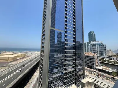 a view of a tall building and a highway at Studio in Studio One Marina in Dubai