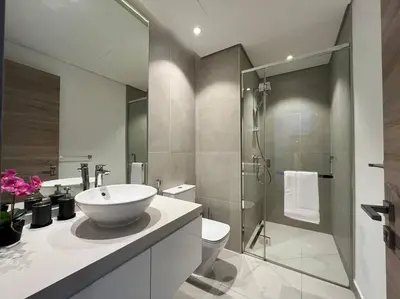 a bathroom with a sink and a toilet and a shower at Studio in Studio One Marina in Dubai