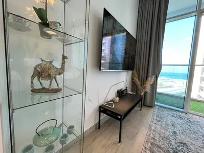 a glass display case with a camel statue in a room at Studio in Studio One Marina in Dubai