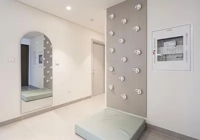 a room with a wall with footprints on it at Kinfolk Homes - 5-Star Family Stay, 8 Minutes Walk to Dubai Mall & Burj Khalifa in Dubai