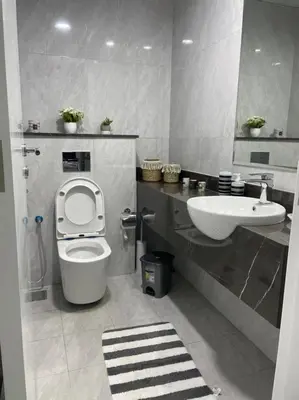 a bathroom with a toilet and a sink at Luxury & Comfort in Majan A Dubai Delight in Dubai
