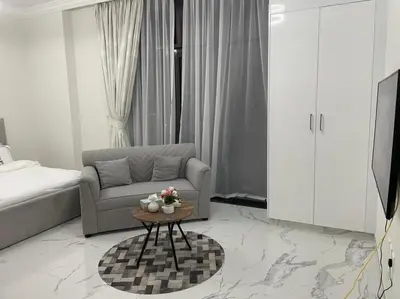 a living room with a couch and a coffee table at Luxury & Comfort in Majan A Dubai Delight in Dubai