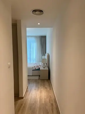 a small room with a bed and a window at 2 Bedroom in Noora Tower, Fully furnished, Sea View in Dubai