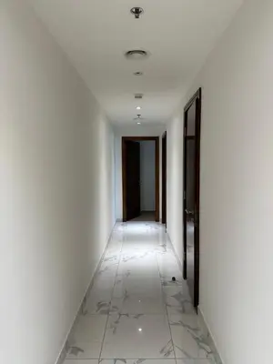 an empty hallway with white walls and white floors at 2 Bedroom in Noora Tower, Fully furnished, Sea View in Dubai