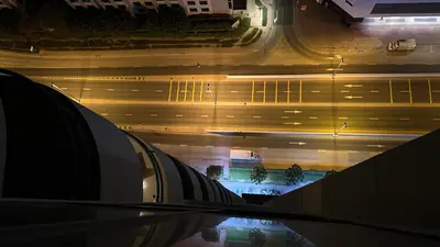 an aerial view of a city street at night at Canvas Partition Room in Barsha Heights Near Metro in Dubai