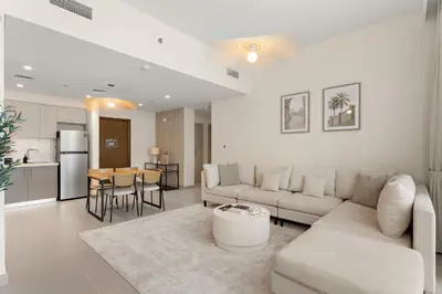 a living room with a couch and a table at Superb 1Bed With Pool & Gym near the Burj Khalifa in Dubai