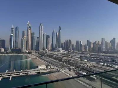 a view of a large city with tall buildings at 2 Bed - Sunrise Bay Views in Dubai