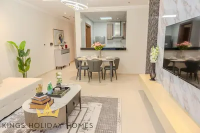 a rendering of a living room and dining room at Royal suites Dunya tower Burj Khalifa St Kings in Dubai