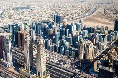 an aerial view of a large city with tall buildings at Pathfinder Partition Room in Barsha Heights Tecom in Dubai