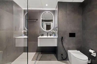 a bathroom with a toilet and a sink and a mirror at Full Sea View - Spacious & Newly Renovated Studio in JBR in Dubai
