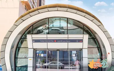 an entrance to a building with a car in the window at Quiet Partition Room in Tecom Barsha Heights in Dubai