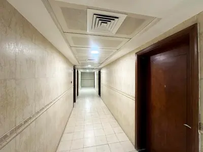 an empty corridor with a door and a corridorngthngthngthngthngthngthngth at Horizon View Partition Room in Barsha Heights Near Metro in Dubai