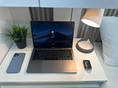 a laptop computer sitting on top of a desk with a mouse at Horizon View Partition Room in Barsha Heights Near Metro in Dubai