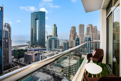 a room with a view of a city skyline at Elite Waterfront 3BR Haven - Marina and Sea Views! in Dubai