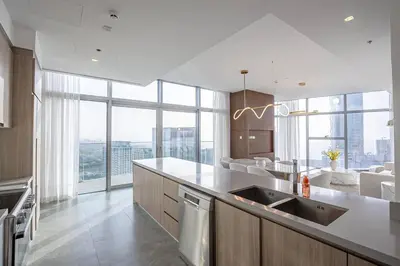 a kitchen with a sink and a large window at Top-Notch 3BR in Stella Maris Tower in Dubai Marina in Dubai