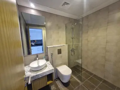 a bathroom with a sink and a toilet and a shower at High rise studio near Dubai Mall in Dubai