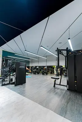 an empty gym with a fitness room with machines at High rise studio near Dubai Mall in Dubai