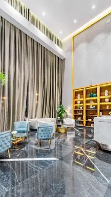 a living room with furniture and a large window at High rise studio near Dubai Mall in Dubai