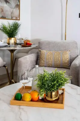 a tray with fruits and wine glasses on a table at Frank Porter - Empire Residences in Dubai