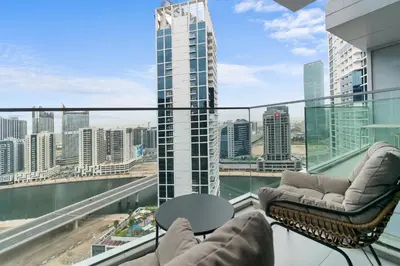 a balcony with a view of a city skyline at Waves - Chic High-Floor Studio Retreat with Canal Views in Dubai