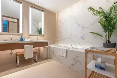 a bathroom with a tub and a sink at The Address Residences Dubai Opera, Full Burj Khalifa View, 2BR Downtown Luxury in Dubai