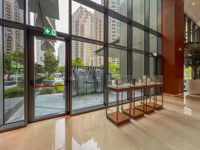 a lobby with large windows and a table with shoes on it at The Address Residences Dubai Opera, Full Burj Khalifa View, 2BR Downtown Luxury in Dubai