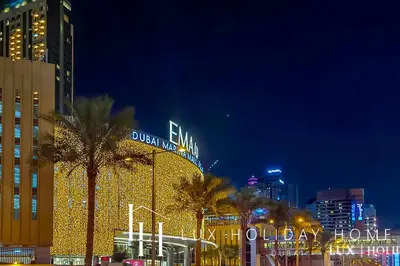 a city with a christmas tree in front of a building at LUX The Silverene Marina View Studio 1 in Dubai