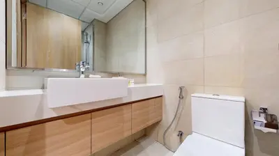 a bathroom with a sink and a toilet at Azizi Riviera 29 - Aesthetic Studio in Meydan in Dubai