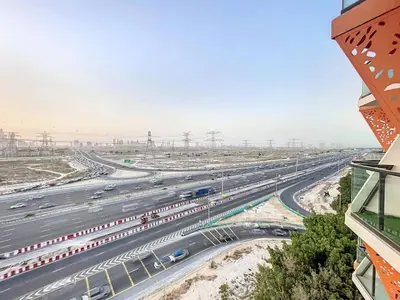 an overhead view of a highway with cars at Locations I Binghatti Gate I Premium Modern 2BR I Skyline & Community Views I Spacious & Comfortable Stay in Dubai