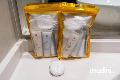 a bag of toiletries sitting on top of a counter at Studio One - Dubai Marina - Pool, Sauna, Hammam and Gym in Dubai