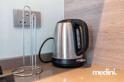 a tea kettle sitting on top of a counter at Studio One - Dubai Marina - Pool, Sauna, Hammam and Gym in Dubai