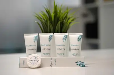 a group of four products sitting on a table at Radiant Parition Room in Barsha Heights Near Metro in Dubai