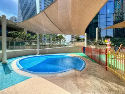 a swimming pool in the middle of a building at Dubai Marina 1BR with Pool Near Shops & Restaurants in Dubai