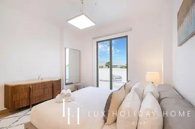 a living room with a couch and a bed at LUX The Elegant Sea View Suite in Dubai
