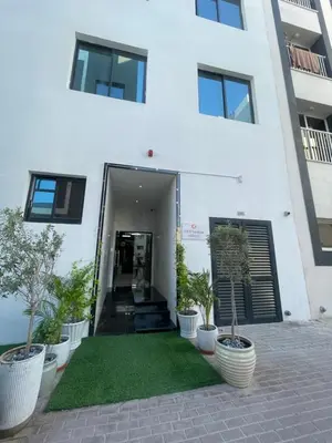 a white building with plants in front of it at Ista Vacation Homes LLC in Dubai