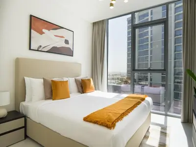 a bedroom with a large bed and a large window at Amazing 2BDR with Lagoon view in District One 13 Al Merkadh in Dubai