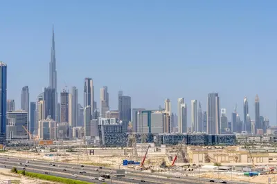 a view of a large city with a highway in the foreground at Marco Polo - Experience luxury living with Burj Khalifa views in Dubai