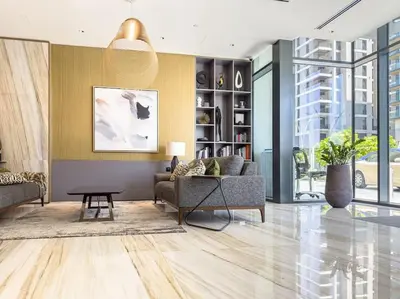 a living room with a couch and a table at Marco Polo - Experience luxury living with Burj Khalifa views in Dubai