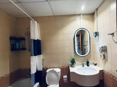 a bathroom with a sink and a toilet and a mirror at Livincci - Luxury Studio in Dubai Marina - 15 in Dubai