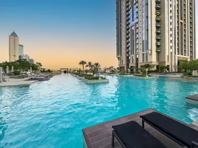a large swimming pool in a city with tall buildings at Luxury Apt in Business Bay Water canal view in Dubai
