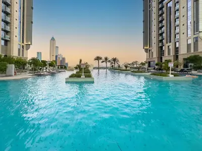 a large pool of blue water in a city at Luxury Apt in Business Bay Water canal view in Dubai