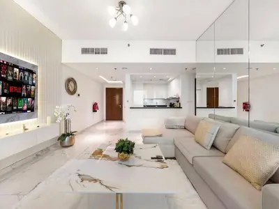 a living room with a couch and a table at Luxury Apt in Business Bay Water canal view in Dubai