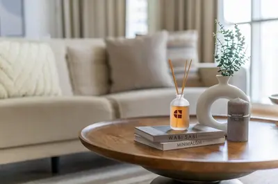 a living room with a coffee table with books and a couch at GuestReady - Luxurious nest direct on JBR Beach in Dubai