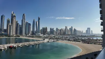 a view of a city with a bridge and a beach at Luxury OneBedroom Apartment next to Barasti Beach in Dubai