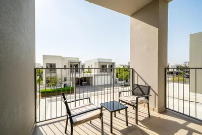 two chairs and a table on a balcony at NewArabian Sidra1 -4 BR & Maid in Dubai